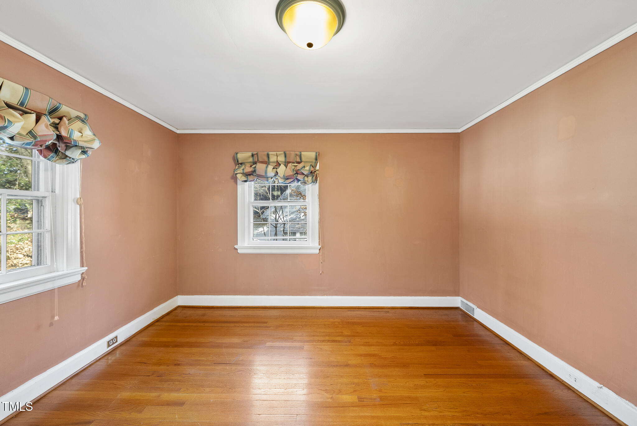 23 Shepherd Street Raleigh, NC 27607 - Photo 26 of 36 a view of a room with wooden floor and window