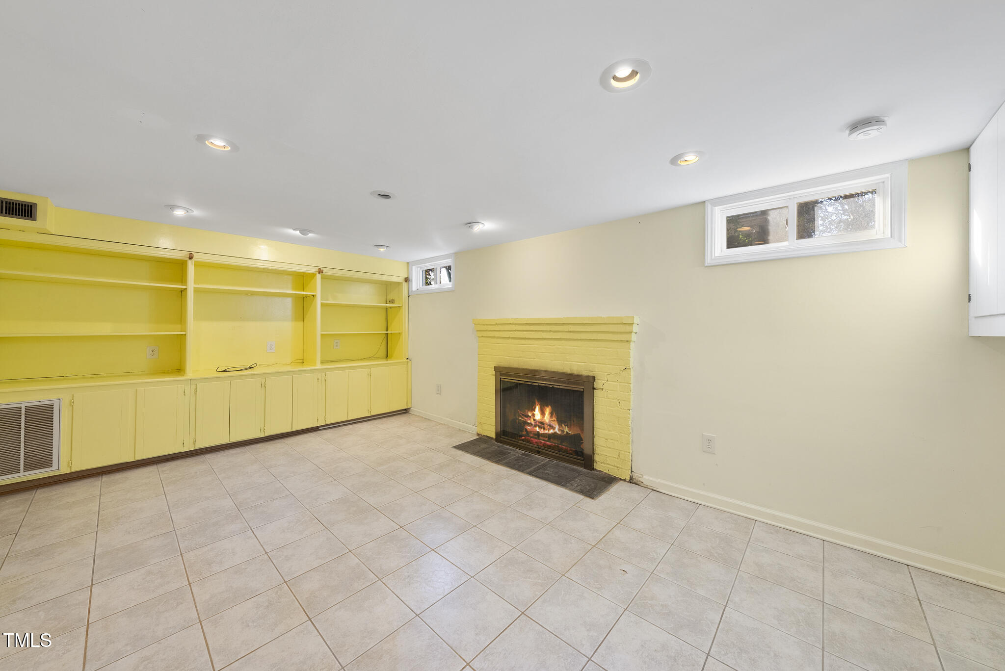 23 Shepherd Street Raleigh, NC 27607 - Photo 29 of 36 a view of an empty room with a fireplace