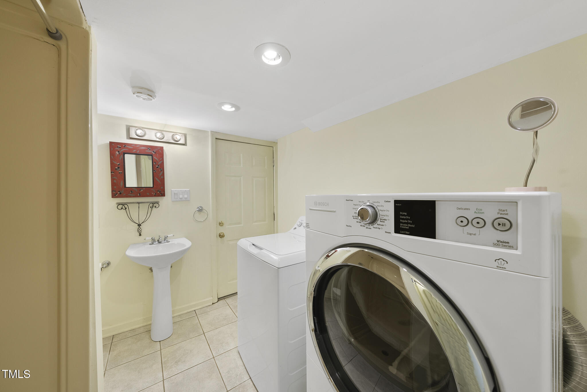 23 Shepherd Street Raleigh, NC 27607 - Photo 30 of 36 a view of a storage and utility room with washer and dryer