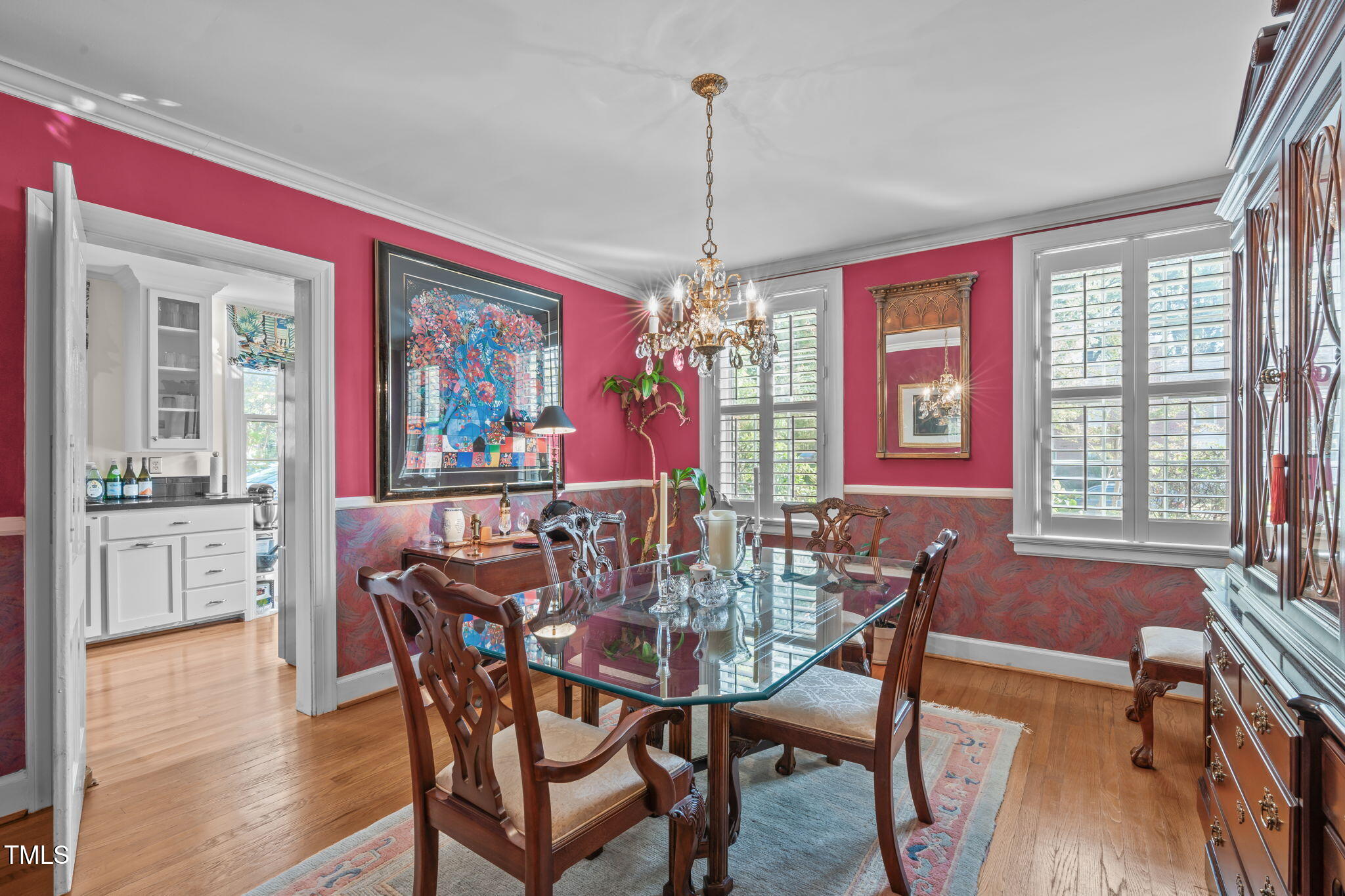 23 Shepherd Street Raleigh, NC 27607 - Photo 8 of 36 a dining room with furniture a chandelier and wooden floor