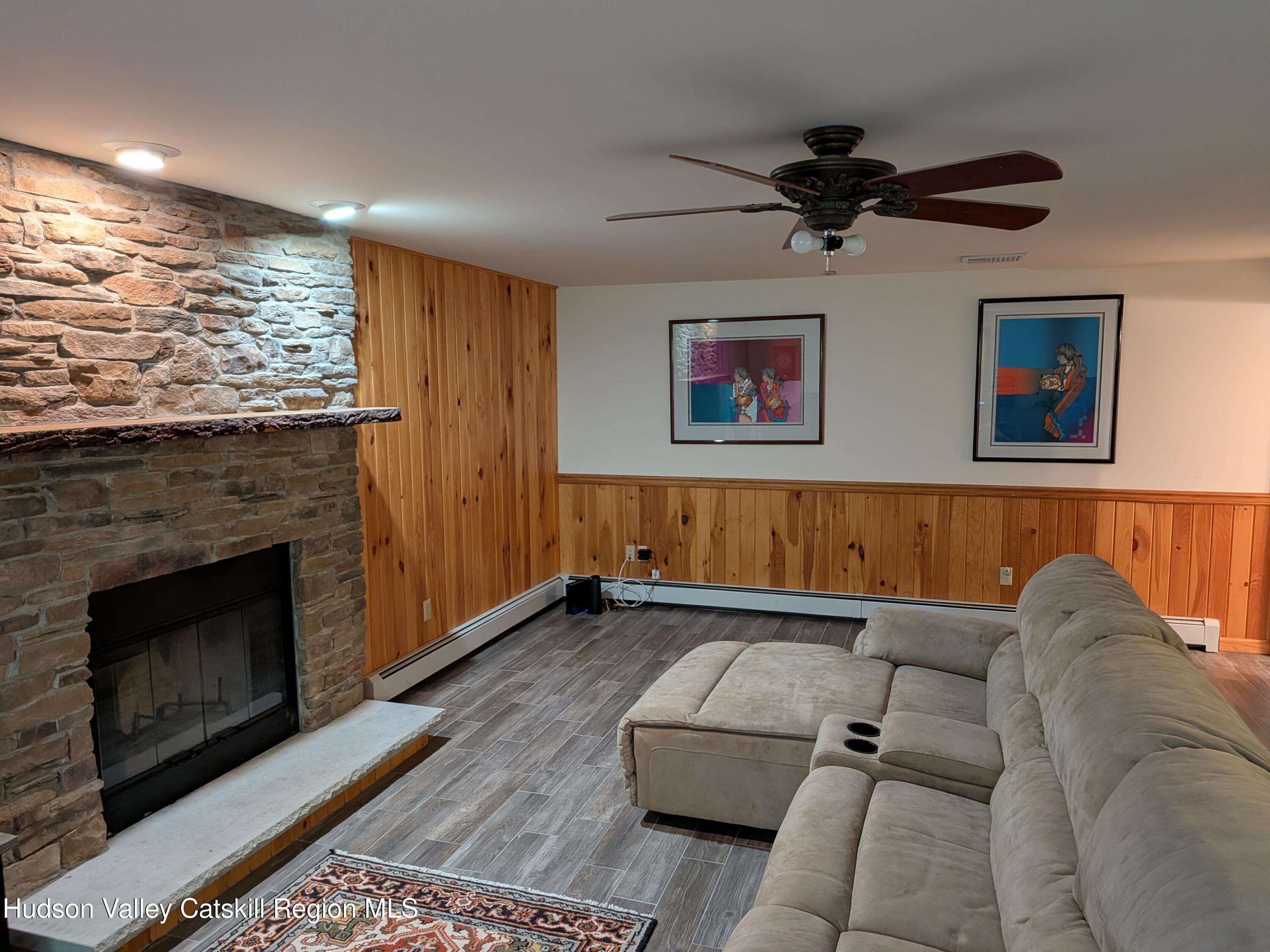 513 South Mountain Road Gardiner, NY 12525 - Photo 35 of 63 a living room with furniture and a fireplace