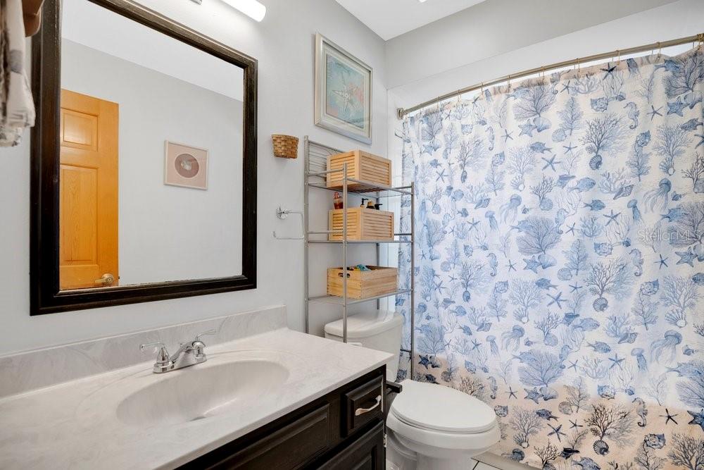525 Rachael Court Oviedo, FL 32765 - Photo 22 of 37 a bathroom with a sink a toilet and shower curtain