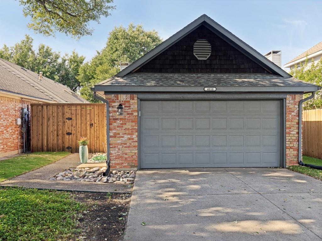 4010 Rive Lane Addison, TX 75001 - Photo 2 of 25 a front view of a house with garden