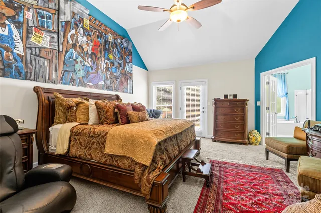 a bedroom with furniture and wooden floor