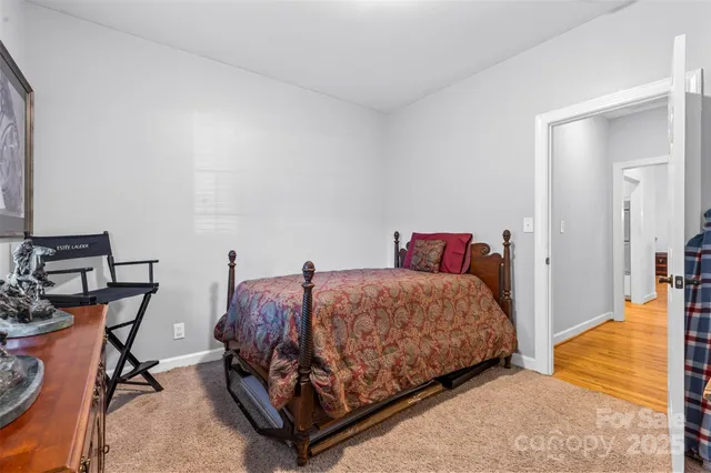 a bedroom with a bed and a chair