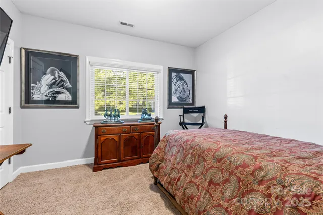 a bed room with a bed and a window