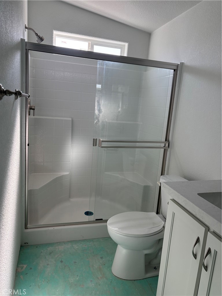 10550 Dunlap Crossing Road, Unit 27 Whittier, CA 90606 - Photo 13 of 13 a bathroom with a shower and a toilet