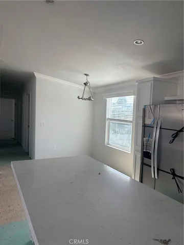 a view of empty room with windows