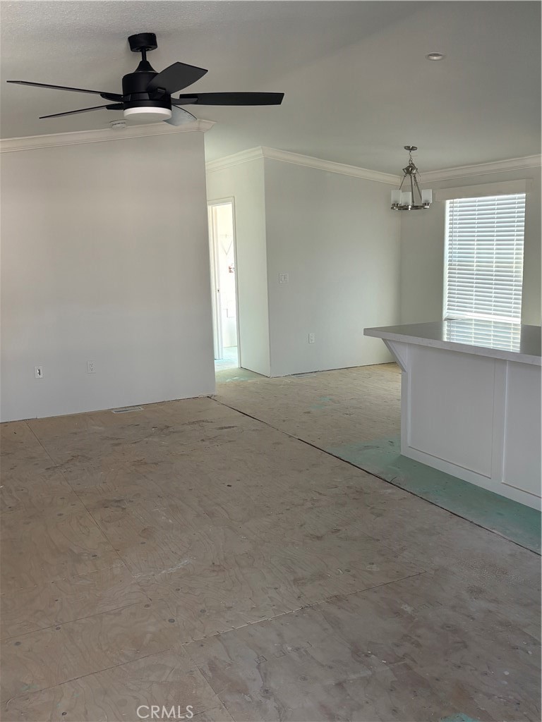 10550 Dunlap Crossing Road, Unit 27 Whittier, CA 90606 - Photo 5 of 13 a view of a livingroom with a ceiling fan and window