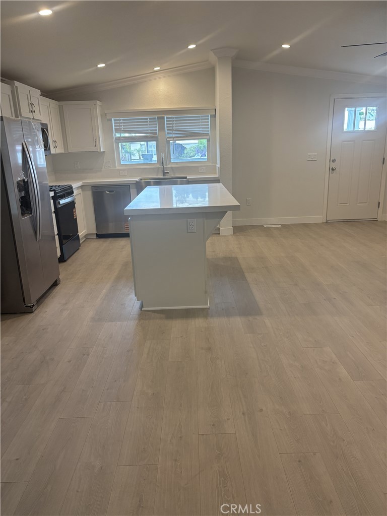10550 Dunlap Crossing Road, Unit 27 Whittier, CA 90606 - Photo 5 of 14 a large kitchen with a sink a refrigerator and window