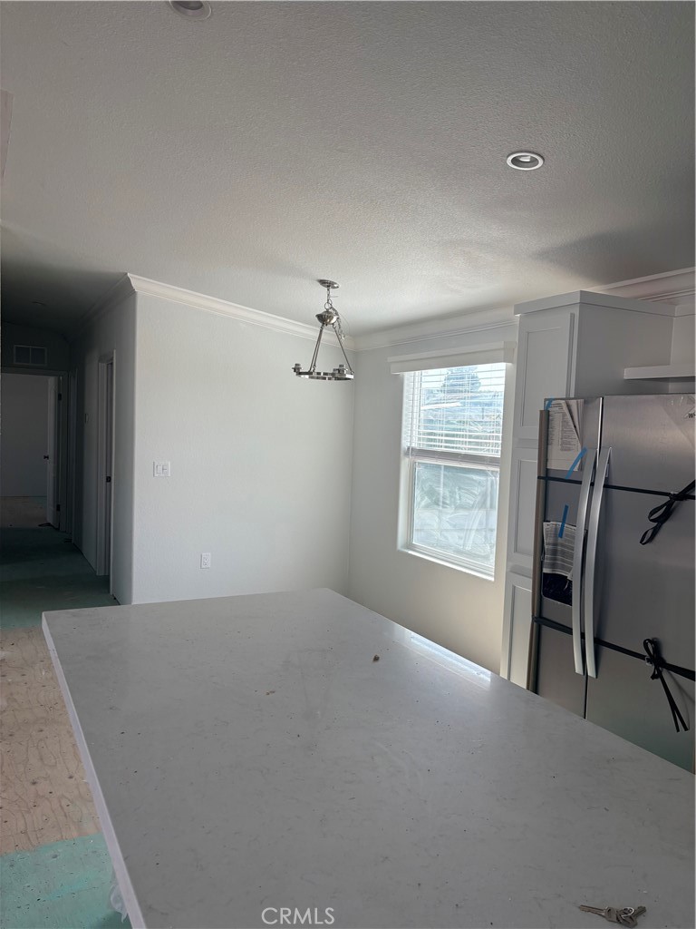 10550 Dunlap Crossing Road, Unit 27 Whittier, CA 90606 - Photo 8 of 13 a view of empty room with windows