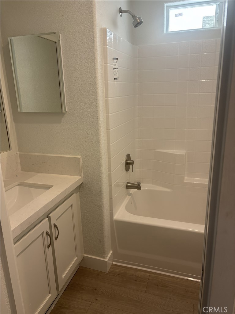 10550 Dunlap Crossing Road, Unit 27 Whittier, CA 90606 - Photo 10 of 14 a bathroom with a sink and a bathtub