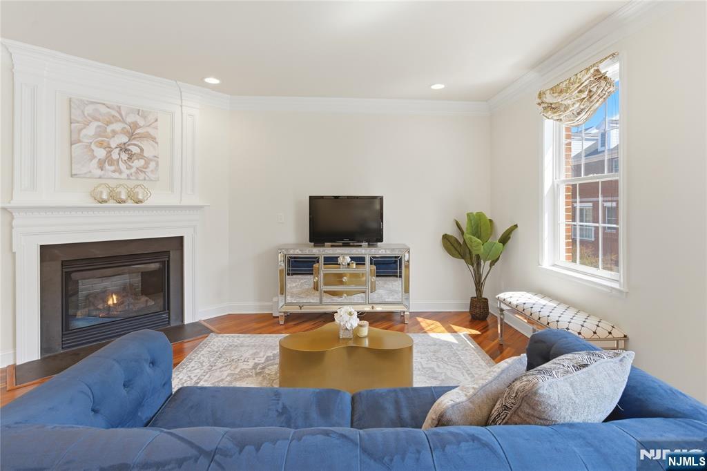 14 Gable Walk Livingston, NJ 07039 - Photo 18 of 41 a living room with furniture and a fireplace