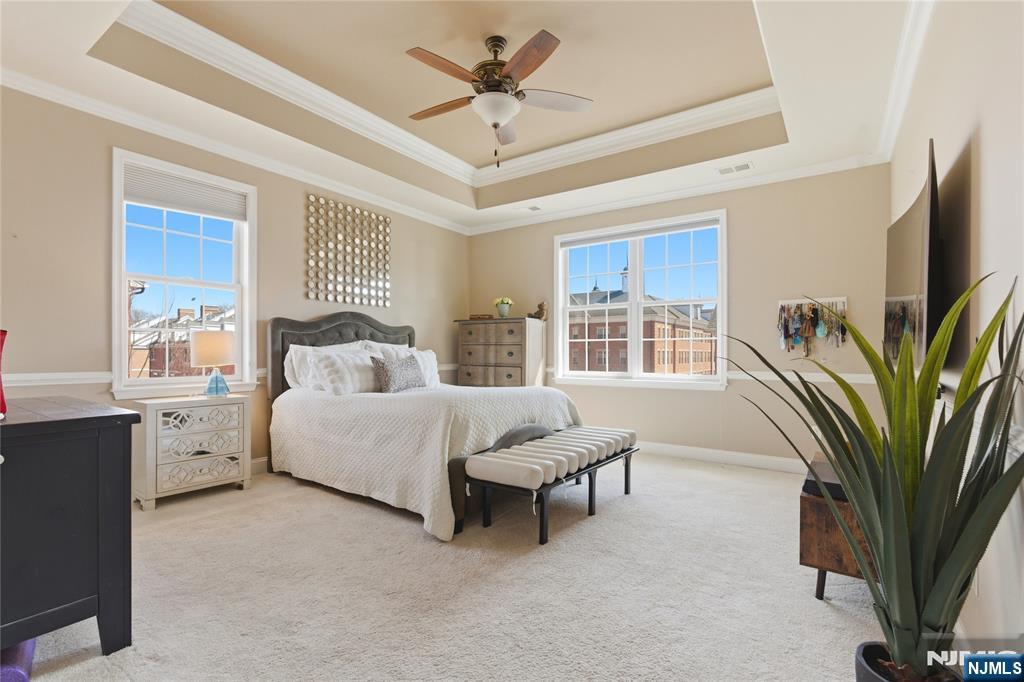 14 Gable Walk Livingston, NJ 07039 - Photo 21 of 41 a spacious bedroom with a large bed and a chandelier