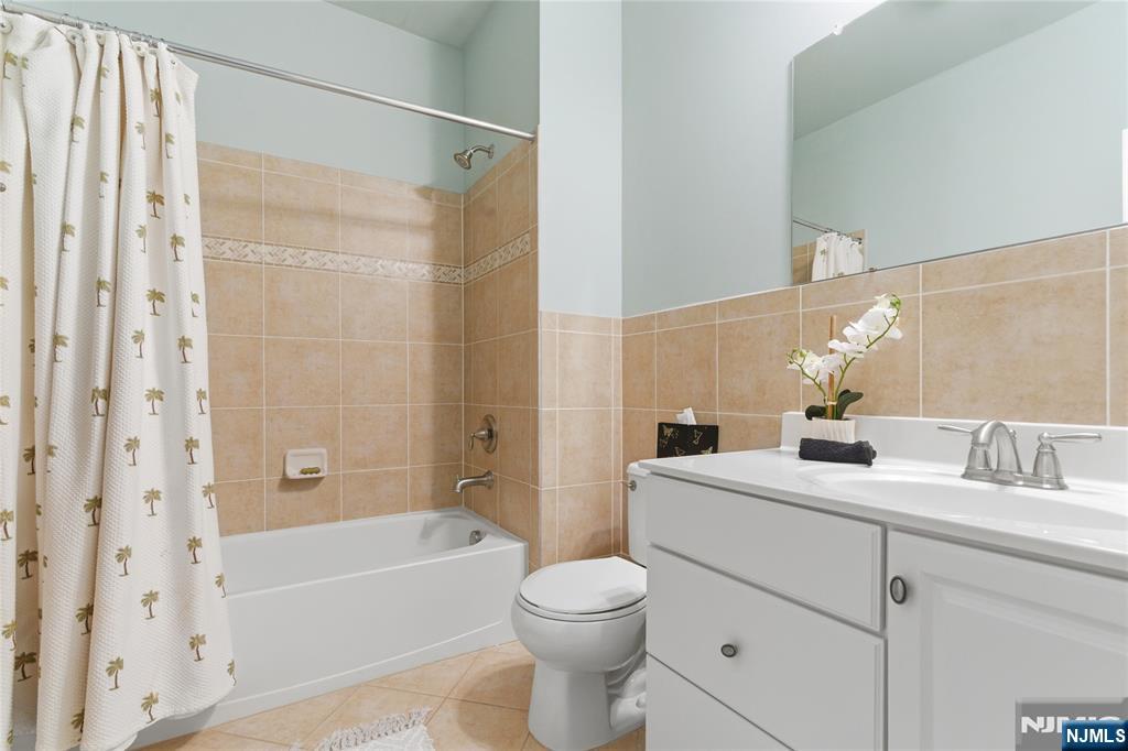 14 Gable Walk Livingston, NJ 07039 - Photo 31 of 41 a bathroom with a sink a toilet and shower