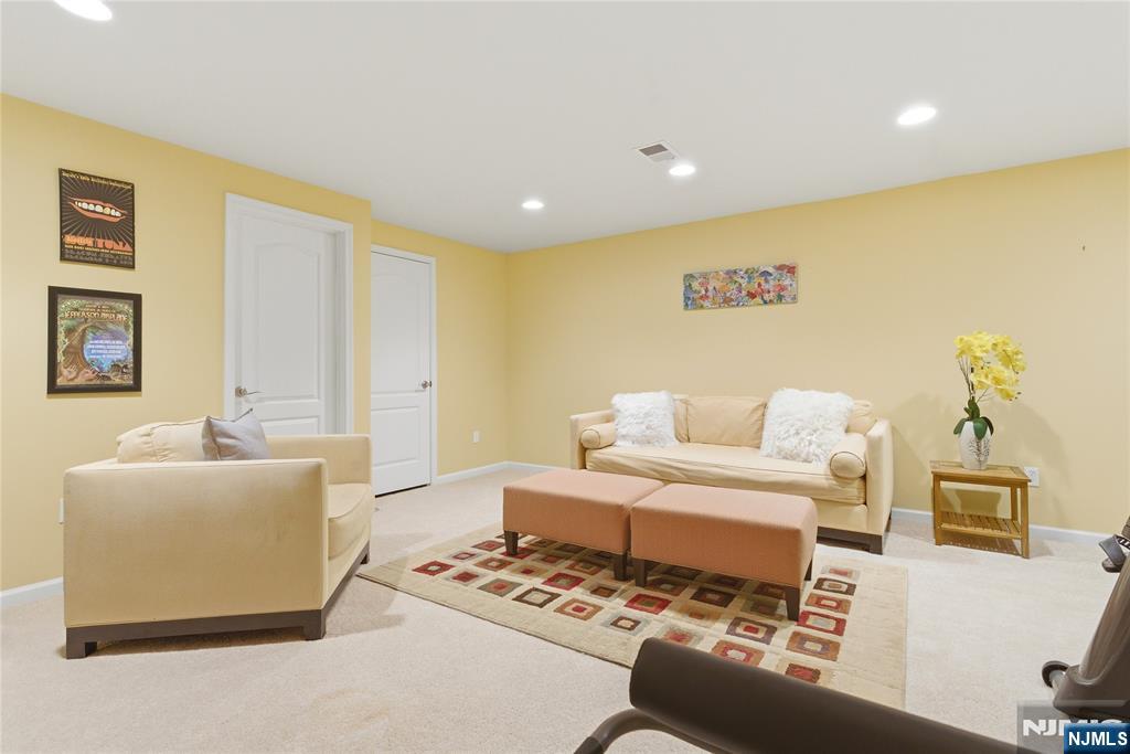 14 Gable Walk Livingston, NJ 07039 - Photo 33 of 41 a living room with a couch and a table with wooden floor