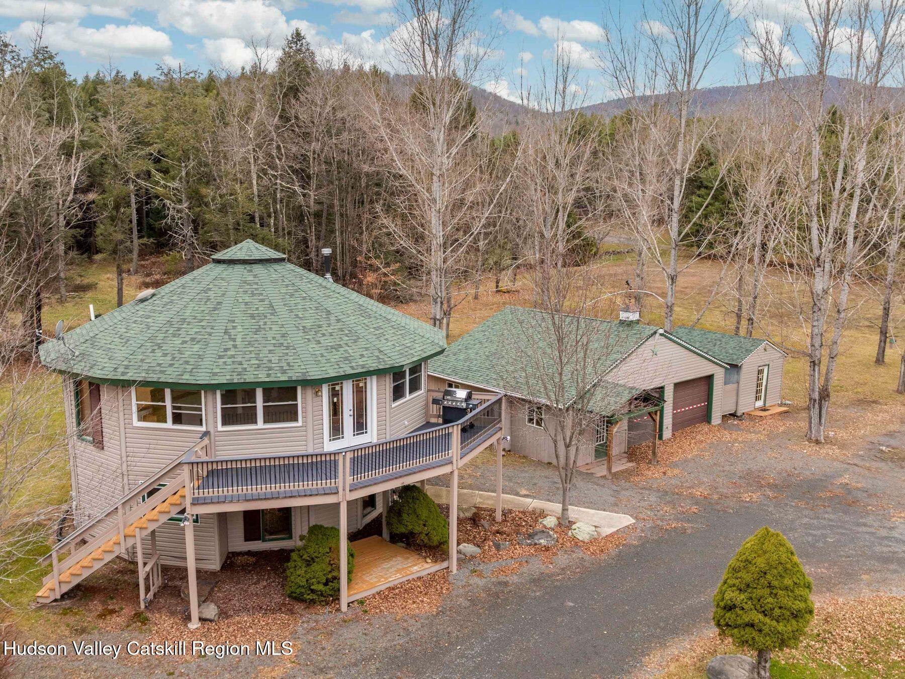 215 Siam Road Windham, NY 12496 - Photo 1 of 65 a view of a house with a yard and sitting area