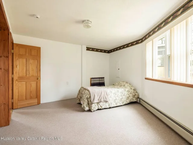 a view of a wooden balcony with a yard