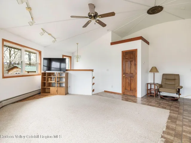 a view of a yard with snow on the road