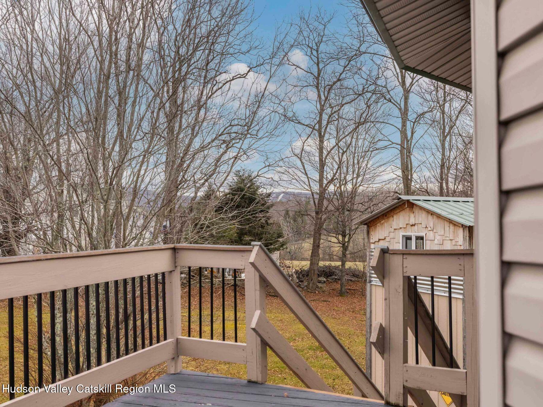 215 Siam Road Windham, NY 12496 - Photo 43 of 65 a view of wooden deck and a forest