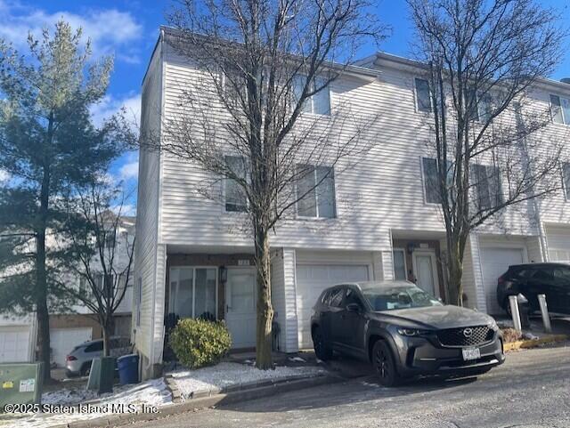 168 Jamie Lane Staten Island, NY 10312 - Photo 2 of 3 a front view of a house with parking space