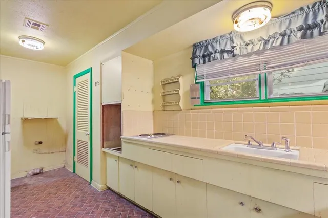 a bathroom with a sink a mirror and a shower