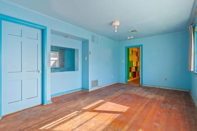 a room that has a bed and a mirror