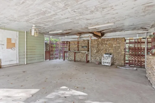 a view of a garage with an empty space