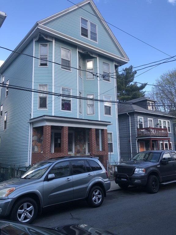 a car parked in front of a house