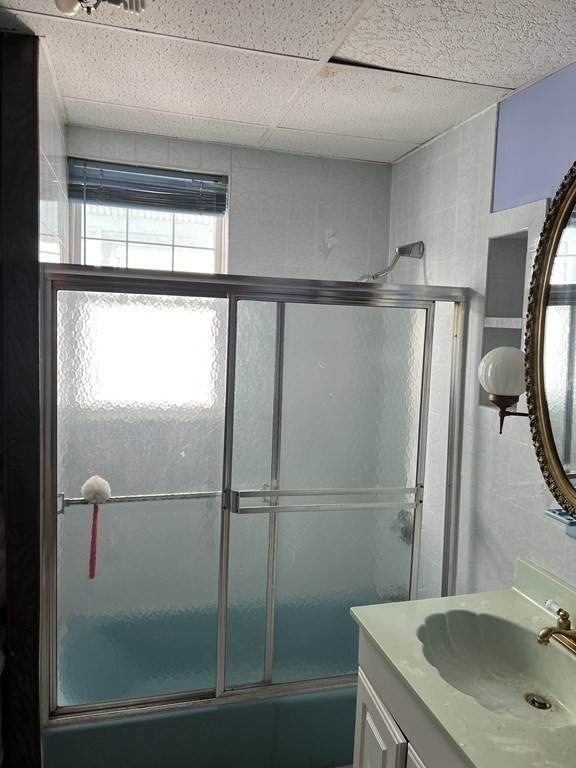 90 Forbes Street Boston, MA 02130 - Photo 12 of 22 a bathroom with a sink and mirror