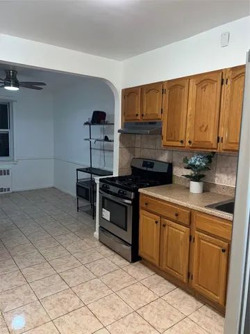 a kitchen with a sink cabinets and appliances