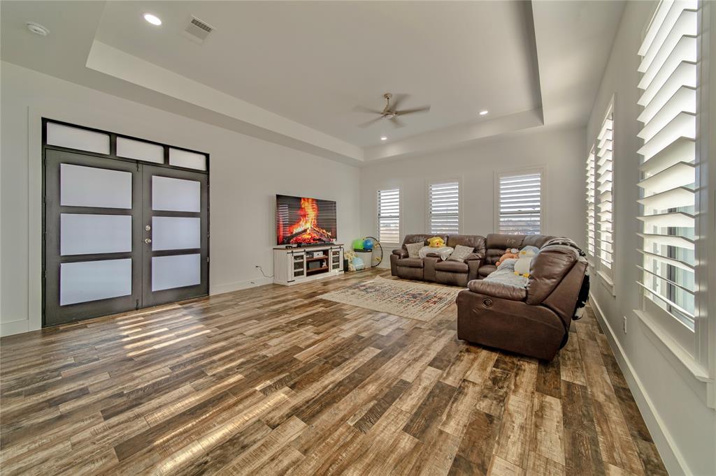 165 Ranch House Road Rockwall, TX 75032 - Photo 19 of 40 a living room with furniture window and wooden floor