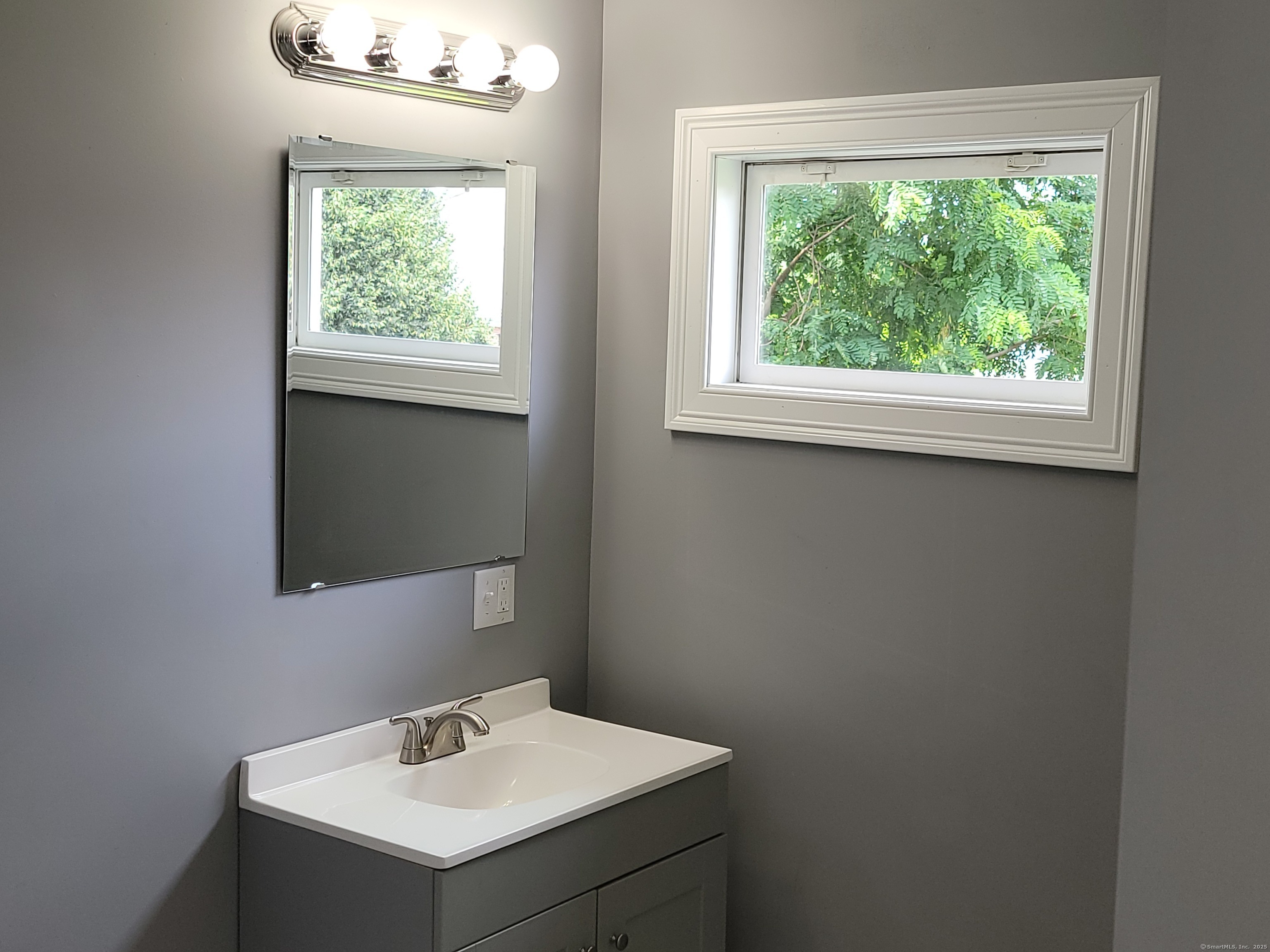 3 Water Street Killingly, CT 06239 - Photo 11 of 38 a bathroom with a sink and a mirror