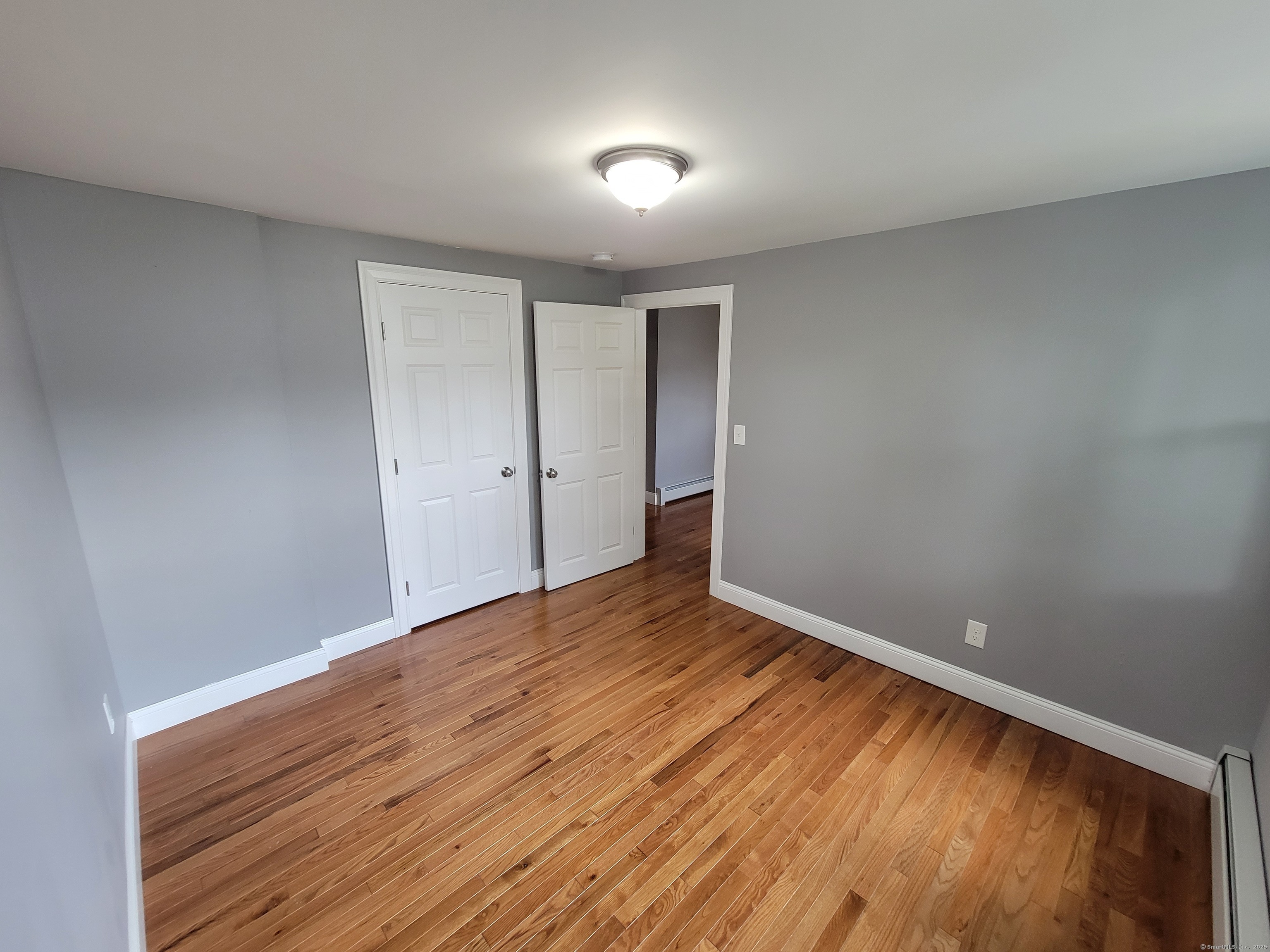 3 Water Street Killingly, CT 06239 - Photo 28 of 38 a view of an empty room with wooden floor