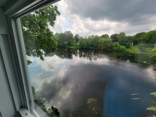 a view of a lake from a balcony