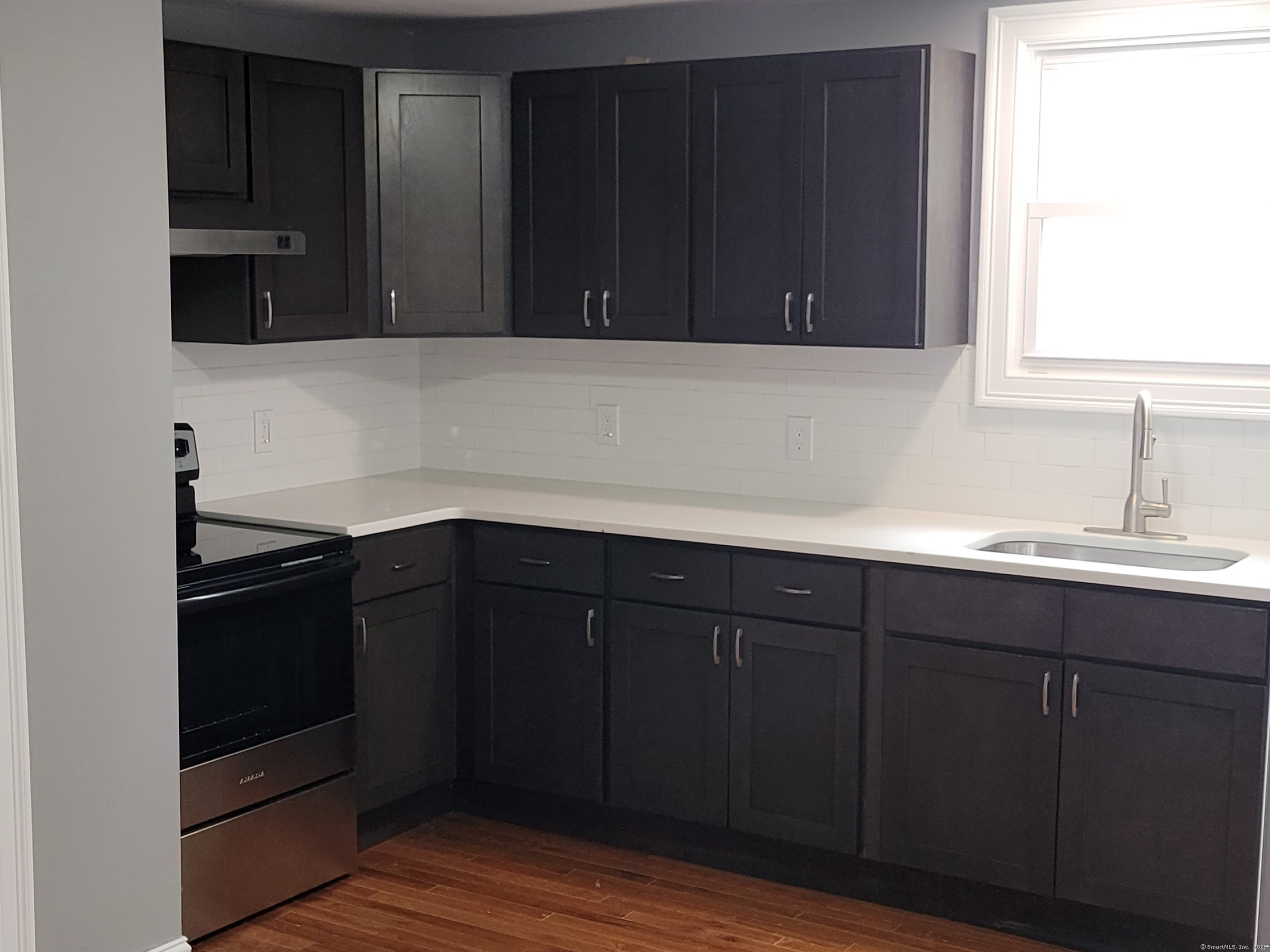 3 Water Street Killingly, CT 06239 - Photo 5 of 38 a kitchen with a sink and cabinets