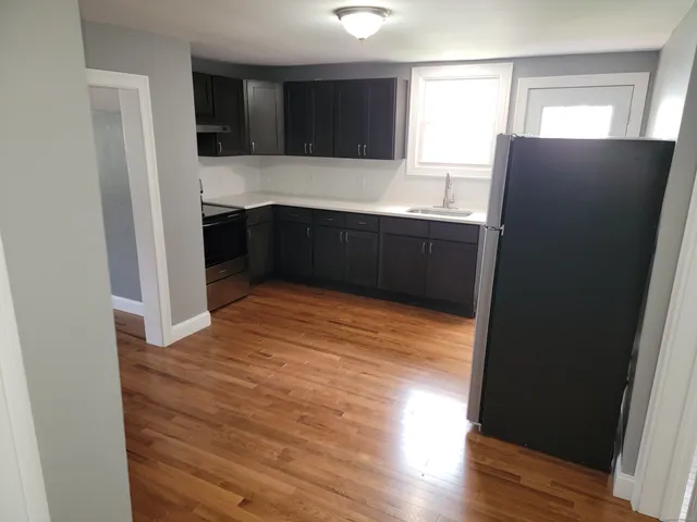a kitchen with stainless steel appliances a refrigerator and a sink