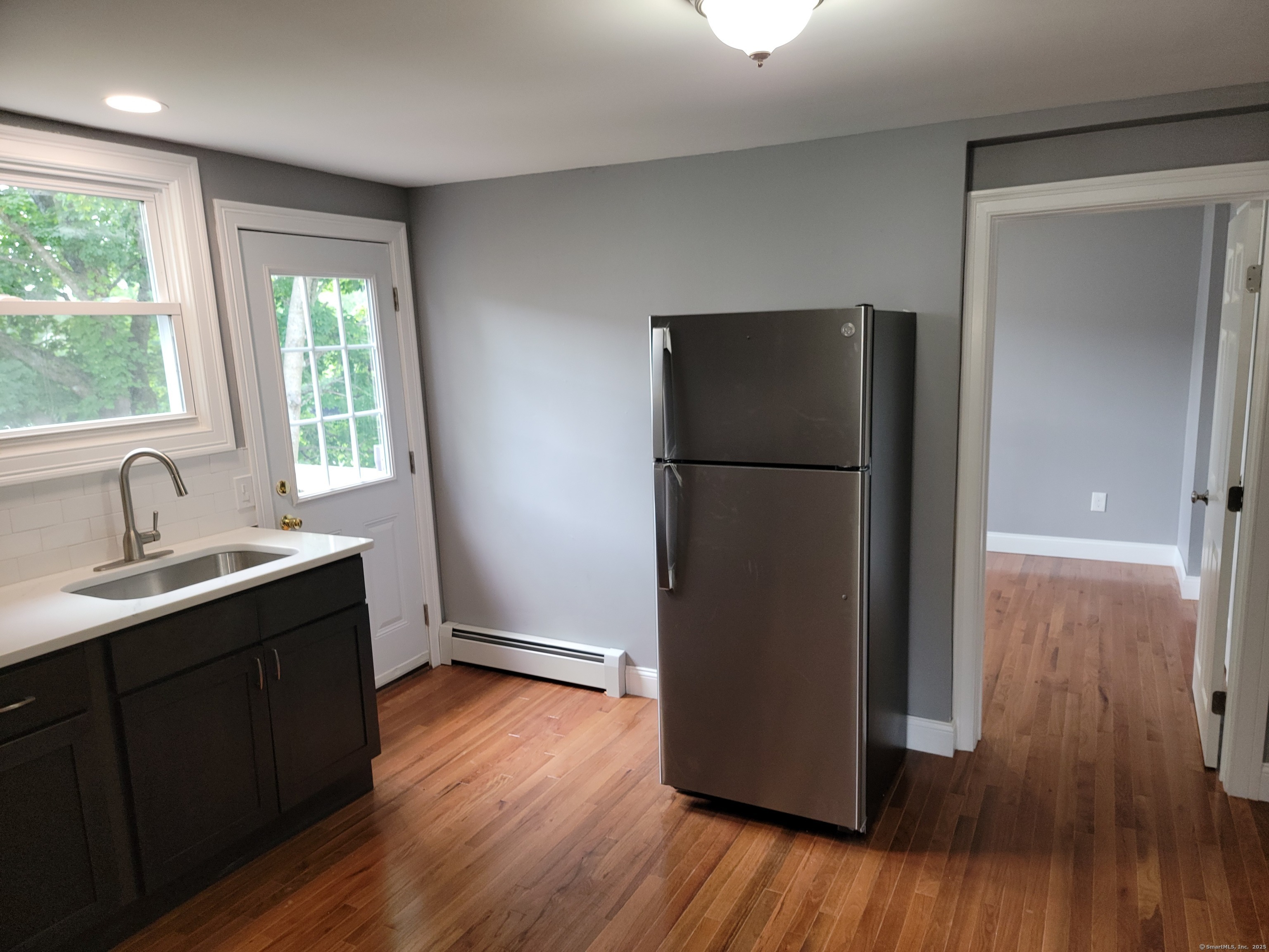 3 Water Street Killingly, CT 06239 - Photo 8 of 38 a kitchen with a refrigerator and a sink