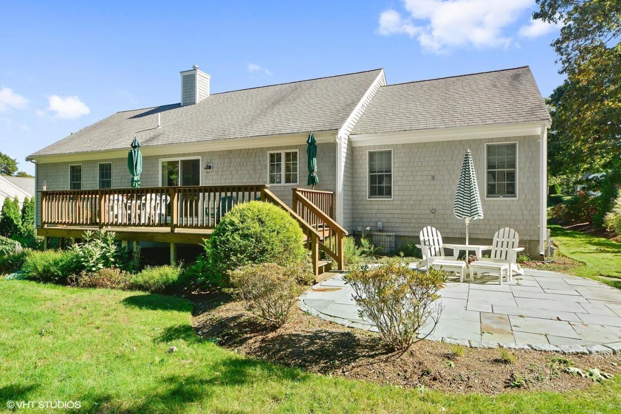 92 Falling Leaf Lane Osterville, MA 02655 - Photo 13 of 15 a front view of a house with garden