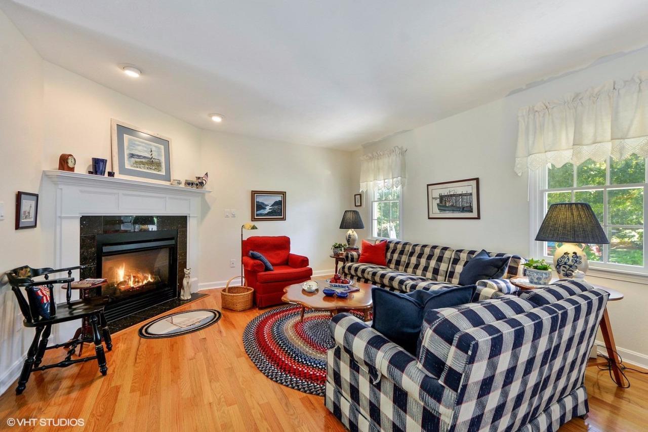 92 Falling Leaf Lane Osterville, MA 02655 - Photo 2 of 15 a living room with furniture and a fireplace