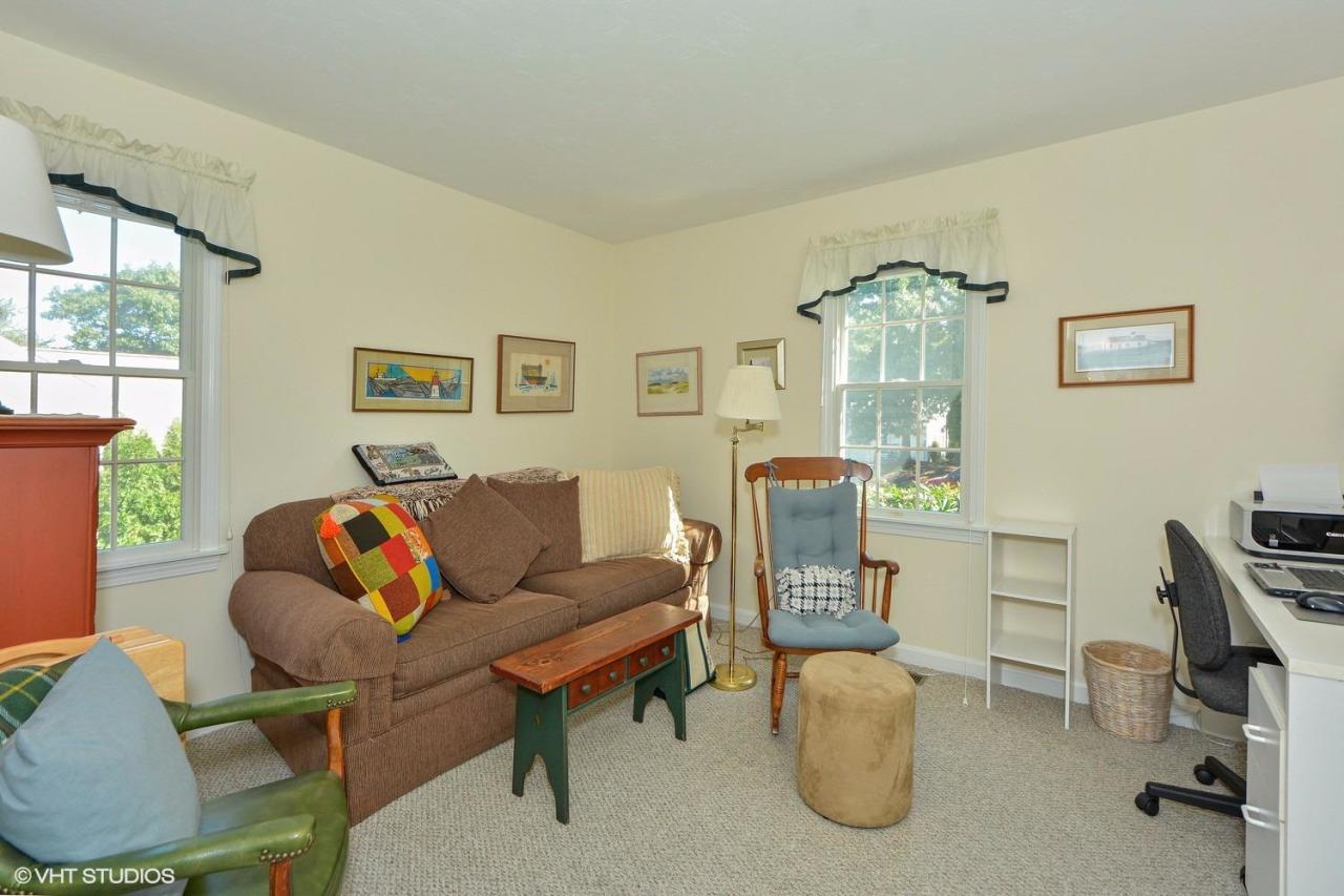 92 Falling Leaf Lane Osterville, MA 02655 - Photo 7 of 15 a living room with furniture a chandelier and a window