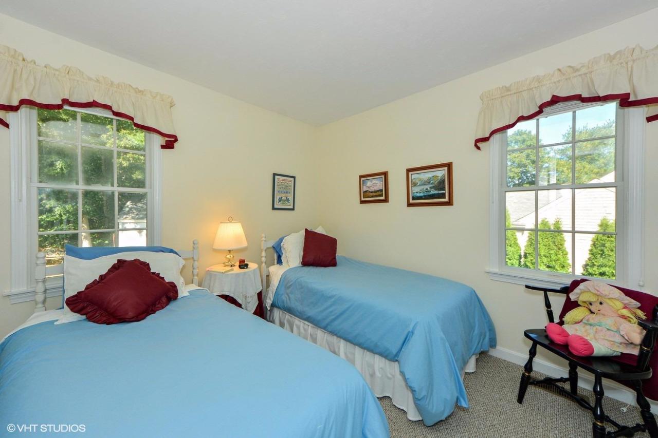 92 Falling Leaf Lane Osterville, MA 02655 - Photo 9 of 15 a bedroom with two beds and a window