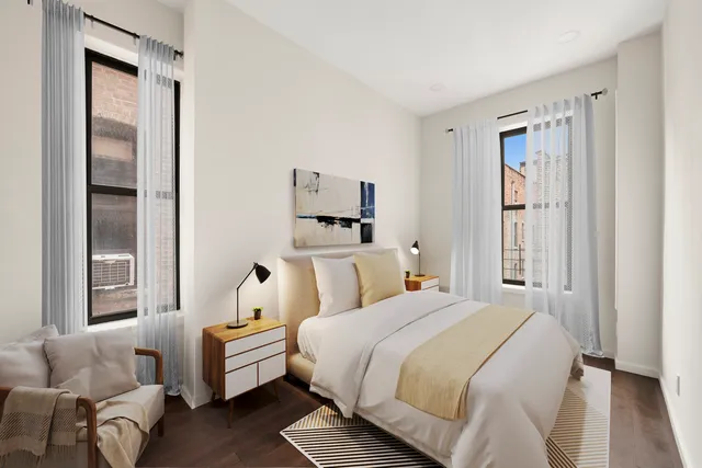 a living room with furniture or couch and a large window