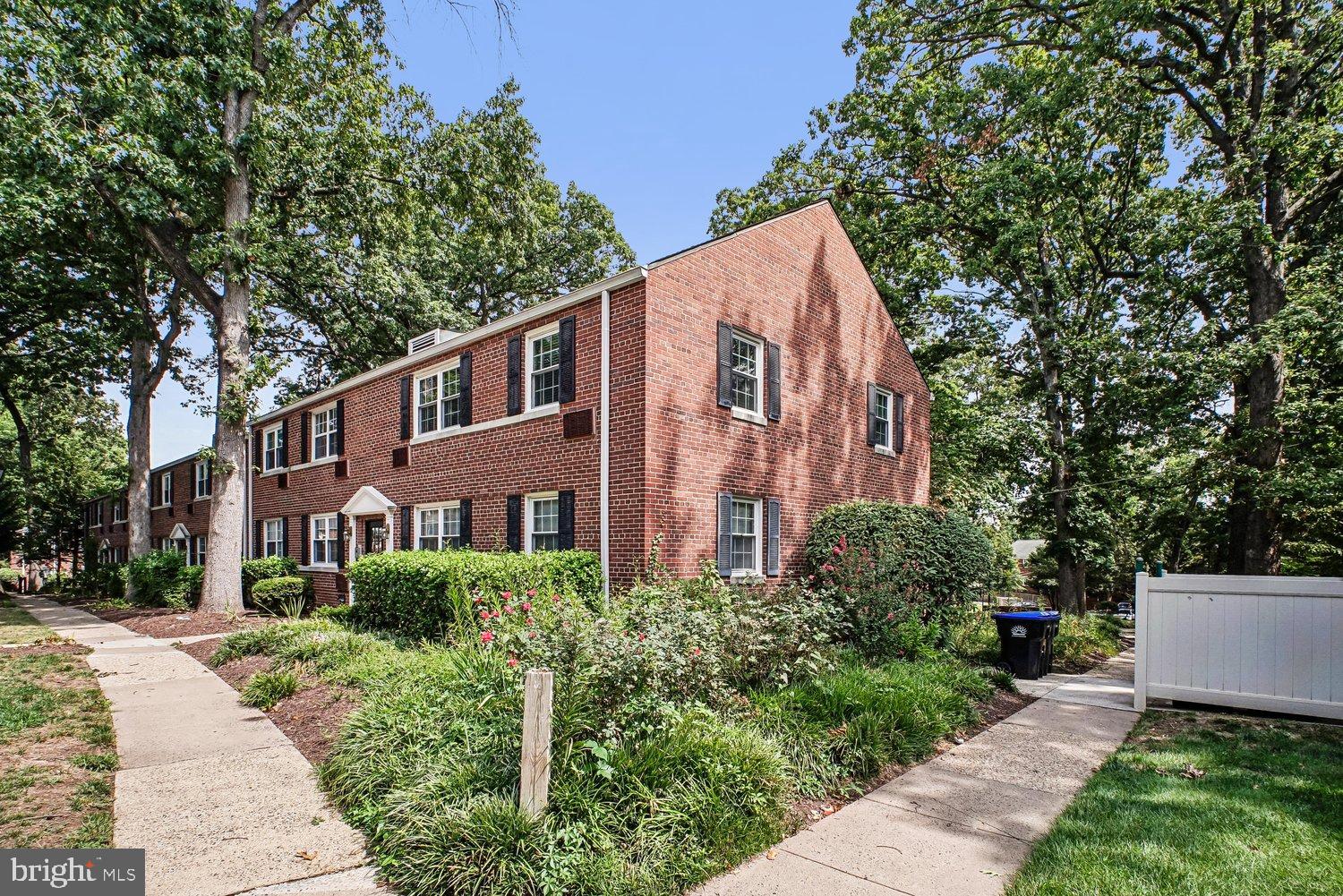 4312 2nd Road North, Unit 2 Arlington, VA 22203 - Photo 1 of 66 Charming brick residence amidst lush greenery.