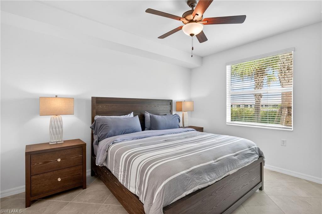 43985 Boardwalk Loop, Unit 2115 Punta Gorda, FL 33982 - Photo 11 of 28 a bedroom with a bed and a window