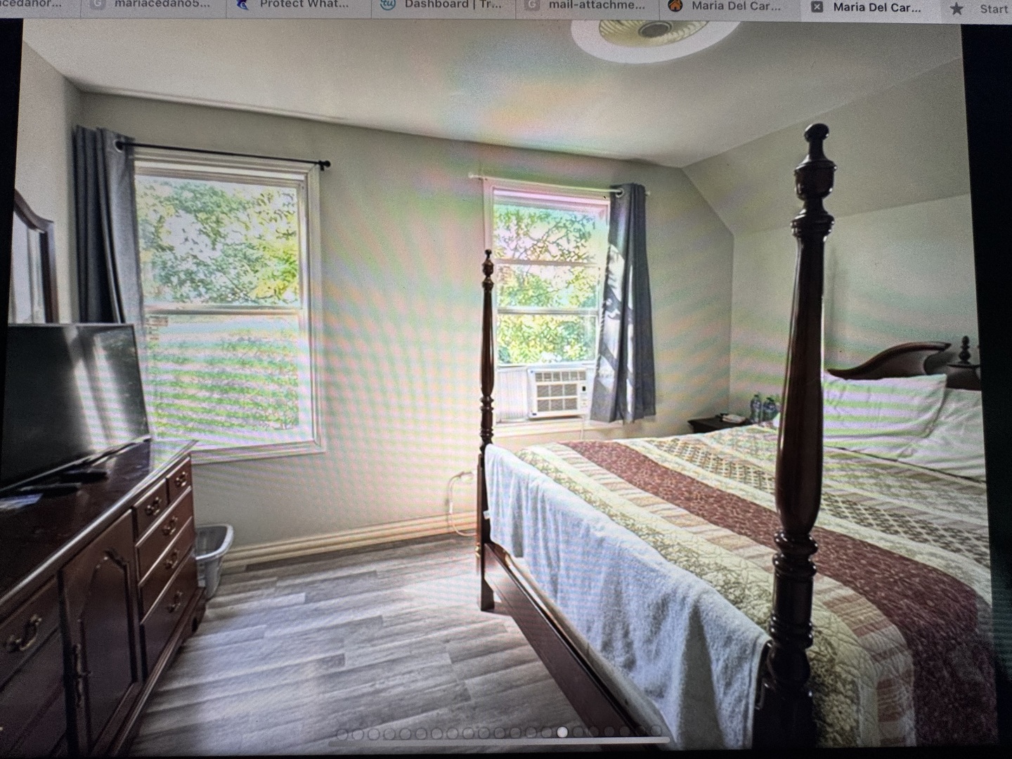 307 Mills Road Joliet, IL 60433 - Photo 18 of 22 a bedroom with a bed and a flat tv screen