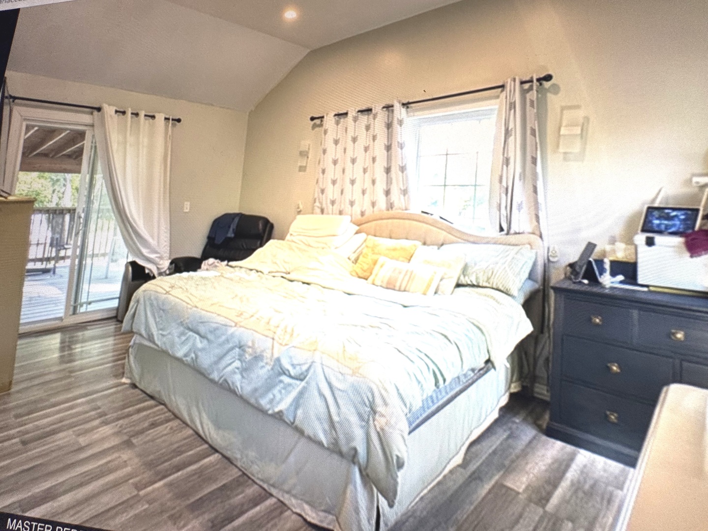 307 Mills Road Joliet, IL 60433 - Photo 20 of 22 a bed sitting in a bedroom next to a window