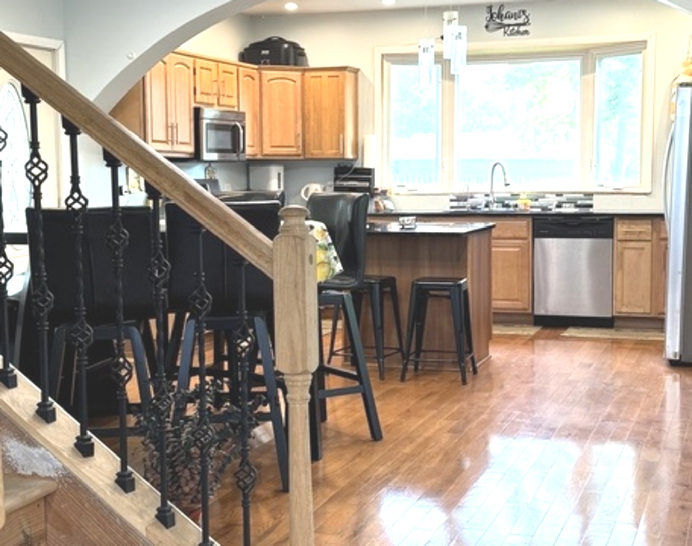 307 Mills Road Joliet, IL 60433 - Photo 2 of 22 a kitchen with stainless steel appliances kitchen island granite countertop a table chairs and a large window