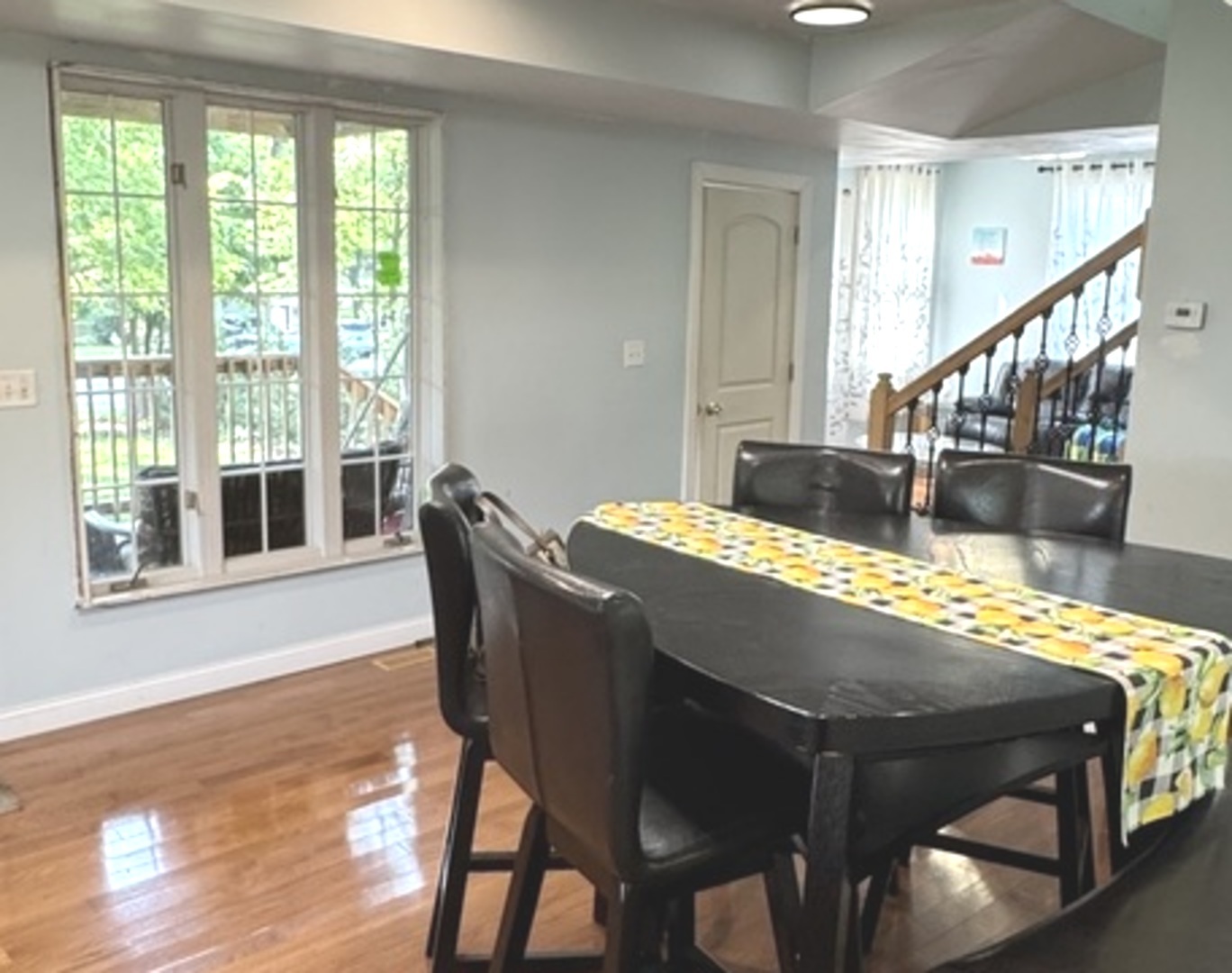 307 Mills Road Joliet, IL 60433 - Photo 6 of 22 a view of a dining room with furniture window and wooden floor