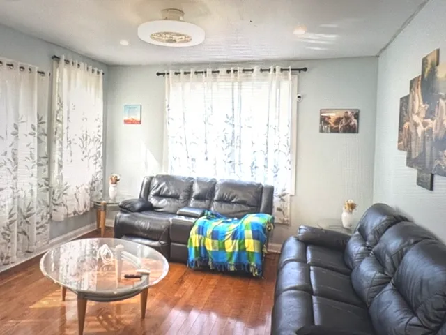 a living room with furniture and a table